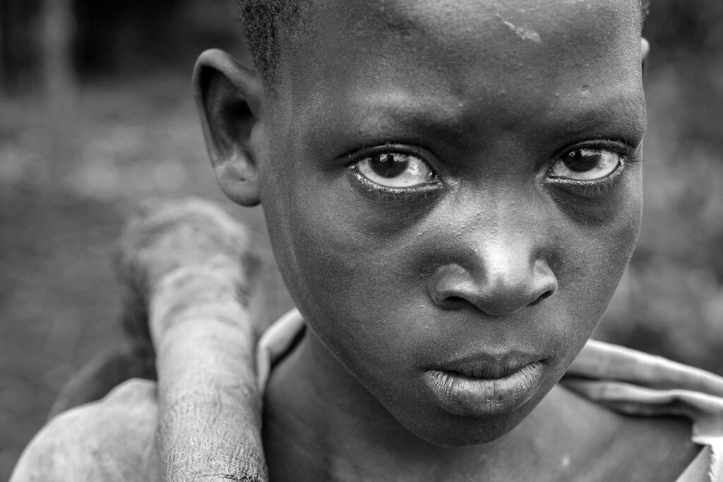 Photo titled Ugandan Girl Working by Chuck Haupt